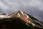 A break in the storm lights up Red Mountain