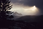 A winter sun breaks out over Engineer Peak.