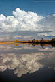 Thunderclouds over the Mesilla Valley and Organ Mountains, reflected in a pool along the Rio Grande River in southern New Mexico