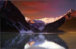 Morning sun tints the clouds at Lake Louise, Banff National Park.