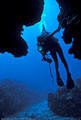 A scuba Diver about to enter one of the Eden Caves, Grand Cayman Island, BWI